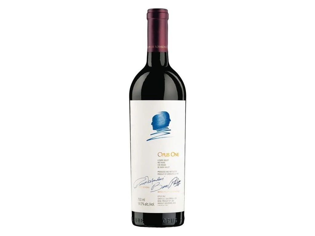 A close-up of the elegant white label of an authentic bottle of Opus One Prestige wine featuring the overlapping blue stylized profile sketches of Robert Mondavi and Baron Philippe de Rothschild along with their signatures.