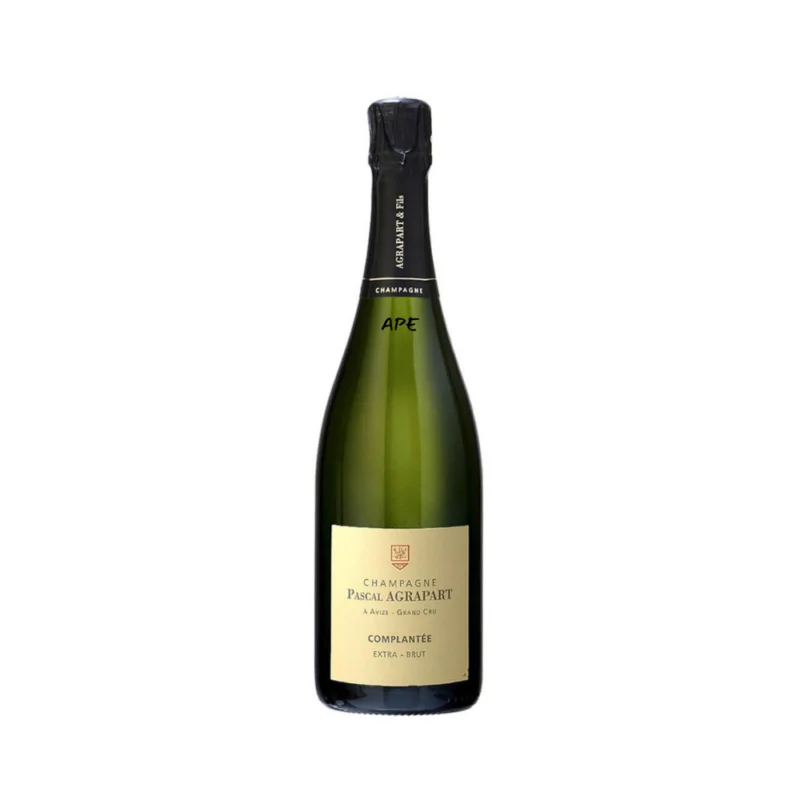 Collin Pierrieres Blanc de Blancs NV bottle by Ulysse Collin standing elegantly under soft gallery lighting, highlighting its minimalist white label and distinctive gold-orange neck foil.