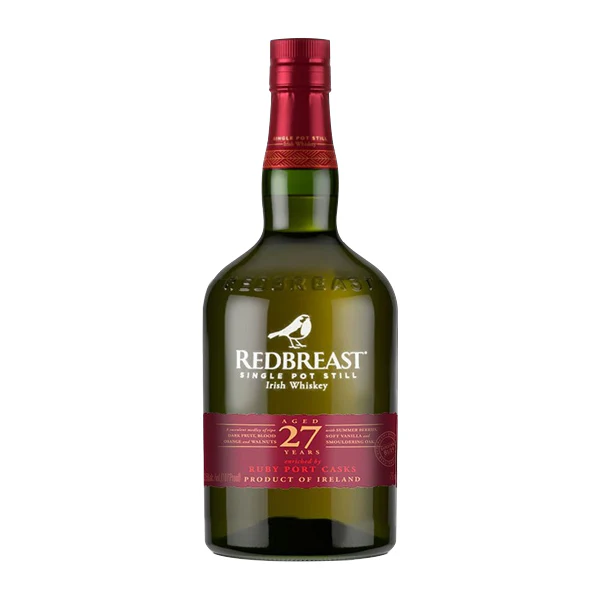 Redbreast 27 Year Old masterpiece bottle design showcasing its signature heavy amber glass shape with its premium crimson and gold labeling nestled within its custom engraved wooden presentation vault.