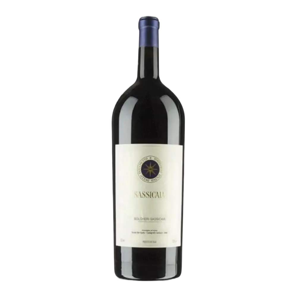 A historic bottle of Sassicaia Gravel Cabernet showing its famous minimalist cream label adorned with an elegant blue and gold eight-pointed compass star emblem, clear vintage typography, and a deep blue capsule on an authentic heavy glass bottle.