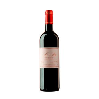 The Latour Pauillac Colossus 2010 vintage bottle standing proudly under gallery lighting showcasing the iconic minimalist white label with the historic stone tower illustration.